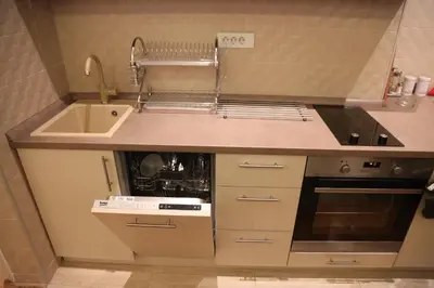 a small kitchen with a sink and a stove at Balkanic Star Belgrade in Belgrade