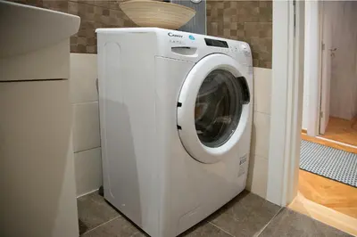 a white washer and dryer in a kitchen at Balkanic Star Belgrade in Belgrade