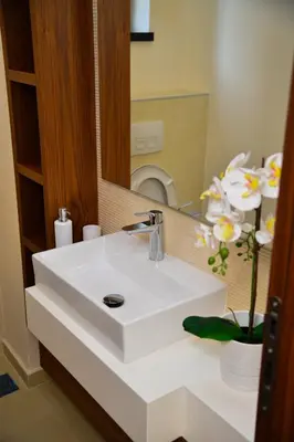 a white sink in a bathroom with a mirror at Lux apartment in city center in Belgrade
