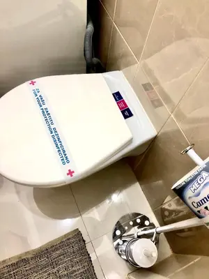 a white toilet in a bathroom with at Apartment Duplex in Pančevo