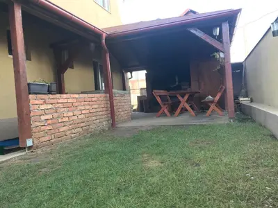 a patio with a picnic table and a brick wall at MM Apartmani in Belgrade