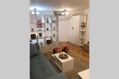 a living room with a couch and a table at Apartman Iva in Belgrade