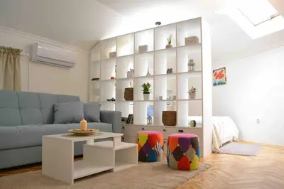 a living room with a couch and a table at Apartman Iva in Belgrade