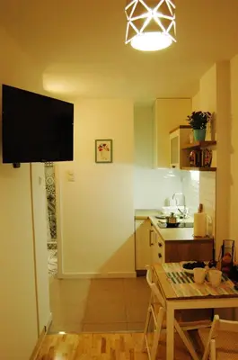 a kitchen with a table and a dining room at Sava river in Belgrade