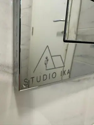 a mirror with a sign that says studio kaza at Studio IKA Belgrade Airport Free Parking possible Self Check-In Terrace in Ledine
