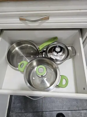 two pots and pans sitting in a kitchen sink at Apartman Viktor in Belgrade