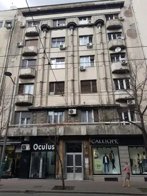a tall building on the corner of a street at Apartman Viktor in Belgrade