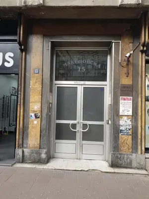 a door to a building with a sign above it at Apartman Viktor in Belgrade