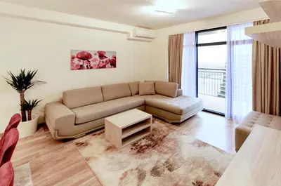 a living room with a couch and a table at MVP apartment - Belgrade Waterfront in Belgrade