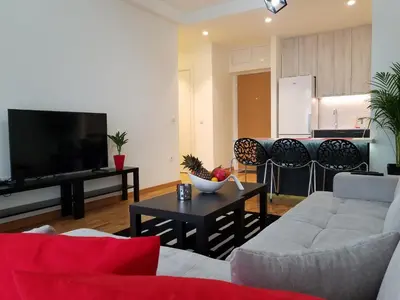 a living room with a couch and a tv at Belgrade Waterfront Lux 1 in Belgrade