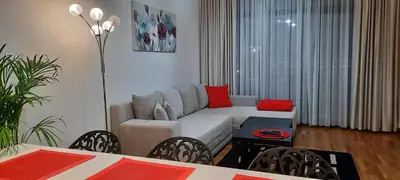 a living room with a couch and a table at Belgrade Waterfront Lux 1 in Belgrade