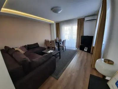 a living room with a couch and a table at Divizija Lux apartments in Belgrade