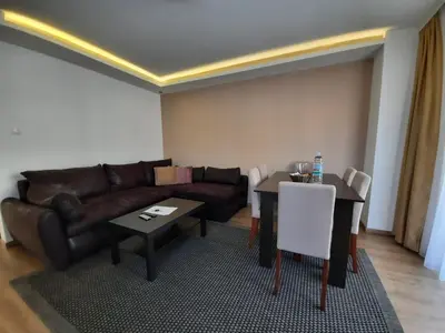 a living room with a couch and a table at Divizija Lux apartments in Belgrade