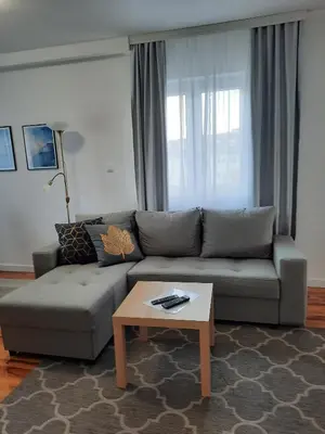 a living room with a couch and a coffee table at Divizija Lux apartments in Belgrade