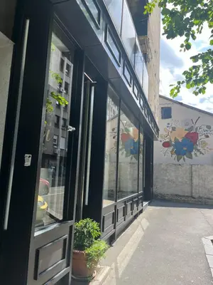 a store front with glass windows and a door at Mosaic in Belgrade