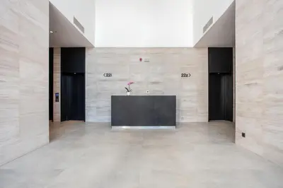 a lobby with a table in the middle of a building at Leo Executive Suite, Self Check-In, Free Garage, FAST Wi-Fi, Concierge in Belgrade