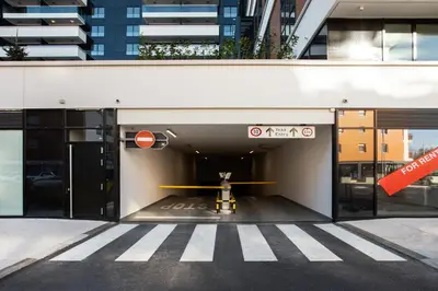 an entrance to a building with a sign that reads exits at Leo Executive Suite, Self Check-In, Free Garage, FAST Wi-Fi, Concierge in Belgrade