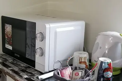 a microwave sitting on top of a counter at Oasis felix apartment in Belgrade