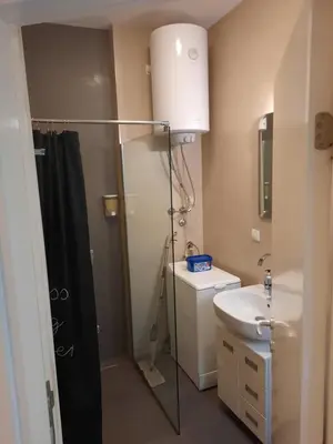 a bathroom with a shower and a sink at SQUARE M. in Belgrade