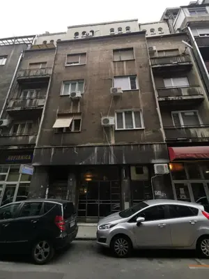 two cars parked in front of a building at SQUARE M. in Belgrade