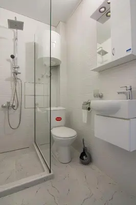 a bathroom with a shower and a toilet and a sink at Filip in Belgrade