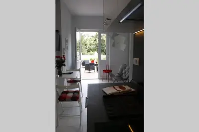 a kitchen and living room with a table and chairs at ROCK - Studio with 30m2 terrace in Belgrade