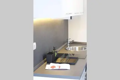 a small kitchen with a sink and a counter top at ROCK - Studio with 30m2 terrace in Belgrade