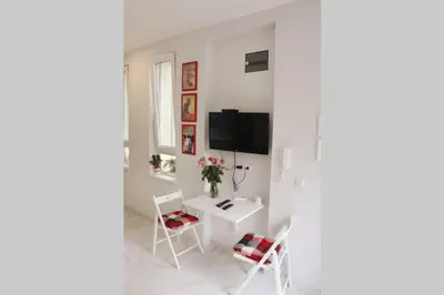 a white room with a white table and chairs at ROCK - Studio with 30m2 terrace in Belgrade