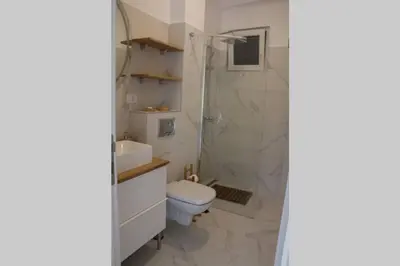 a bathroom with a shower and a toilet and a sink at ROCK - Studio with 30m2 terrace in Belgrade