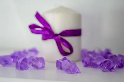 a group of purple crystals sitting next to a clock at Apartman DORA in Arandjelovac