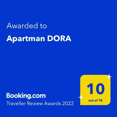 a yellow box with the text awarded to armenian dora at Apartman DORA in Arandjelovac