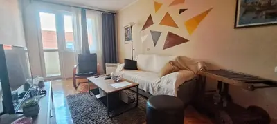 a living room with a couch and a table at Lagumska in Zemun