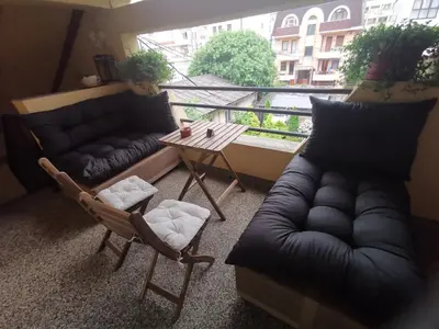 a living room with a couch and a table at VUKAJLO apartment Belgrade in Belgrade