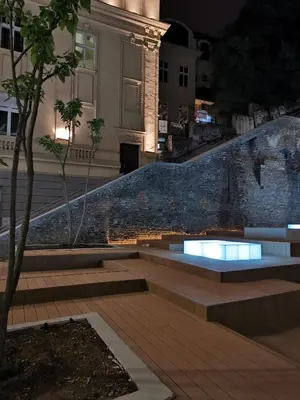a set of stairs in front of a building at night at K43 Apartment in Belgrade
