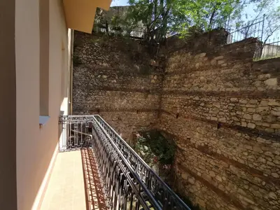 a staircase leading up to a brick wall at K43 Apartment in Belgrade