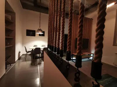 a room with a table and some ropes at K43 Apartment in Belgrade