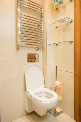 a bathroom with a white toilet in a room at BelArt apartment in Belgrade