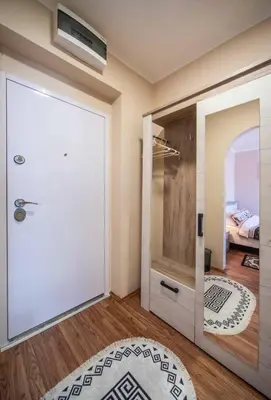 a room with a door leading to a bedroom at Apartment Africa in Belgrade