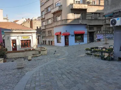 a cobblestone street in front of a building at Apartment Africa in Belgrade