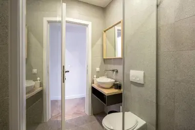 a bathroom with a toilet and a sink at Belgrade Old Town Apartment in Belgrade