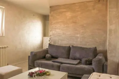 a living room with a couch and a table at Juventas37 in Belgrade