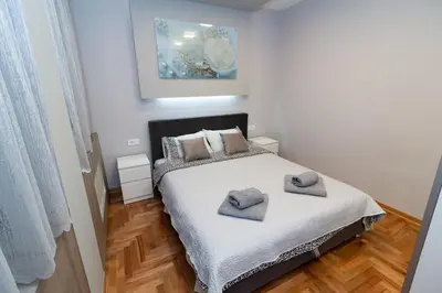 a bedroom with a bed with two pillows on it at New Belgrade Center 2 in Belgrade