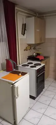 a kitchen with a stove and a stove top oven at A modest place in Belgrade