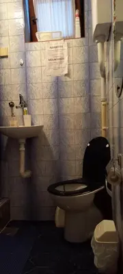 a bathroom with a toilet and a sink at A modest place in Belgrade