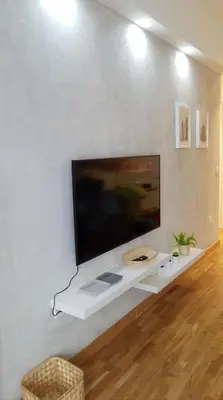 a large flat screen tv on a white wall at Belgrade Waterfront Lux 2 in Belgrade