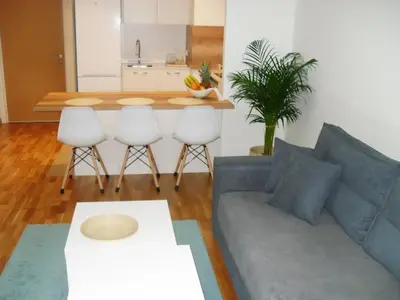 a living room with a couch and a table at Belgrade Waterfront Lux 2 in Belgrade