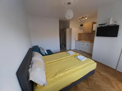 a bedroom with a large bed in a room at Studio 17 in Belgrade