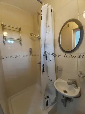 a bathroom with a sink and a toilet and a mirror at Studio 17 in Belgrade