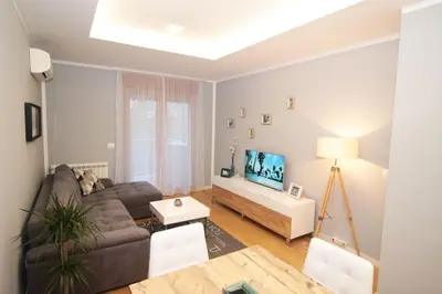 a living room with a couch and a tv at Apartment A block Daja in Belgrade