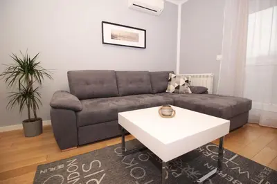 a living room with a couch and a table at Apartment A block Daja in Belgrade